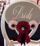 Equestrian Chair Decorations
Photography: Chrisman Studios
Read More:
http://www.insideweddings.com/weddings/a-facebook-executives-rustic-elegant-northern-california-wedding/470/ Bride sign on back of chair with horse show ribbons