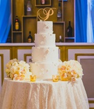 Floral Appliqués on Wedding Cake
Photography: LuvRox Photography
Read More:
http://www.insideweddings.com/weddings/luxurious-destination-wedding-at-the-ocean-club-in-the-bahamas/1324/ four tier white wedding cake with floral appliques and a gold "P" cake topper