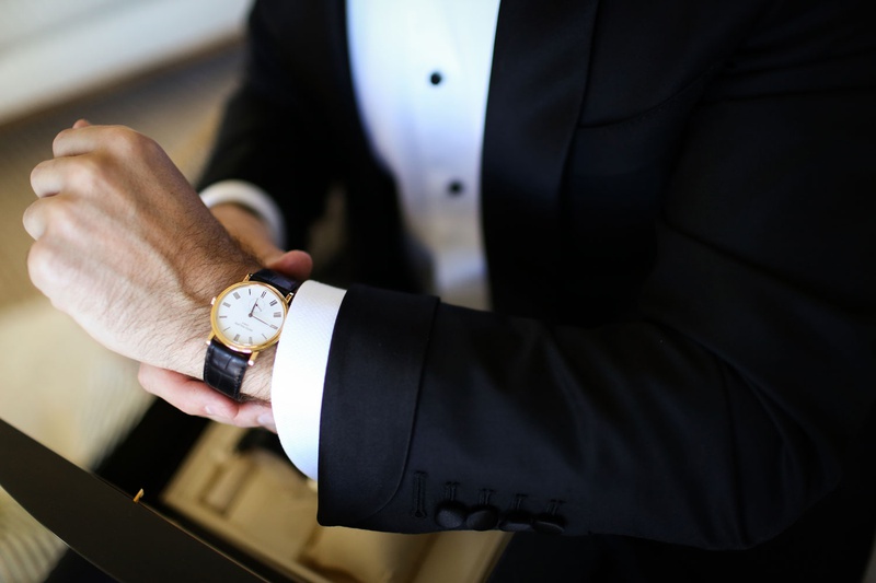 Groom with Black-and-Gold Watch
Photography: Alain Martinez Photography
Read More:
http://www.insideweddings.com/weddings/opulent-luxury-wedding-with-white-gold-color-scheme-in-palm-beach/1375/ groom in tuxedo black buttons black and gold designer watch
