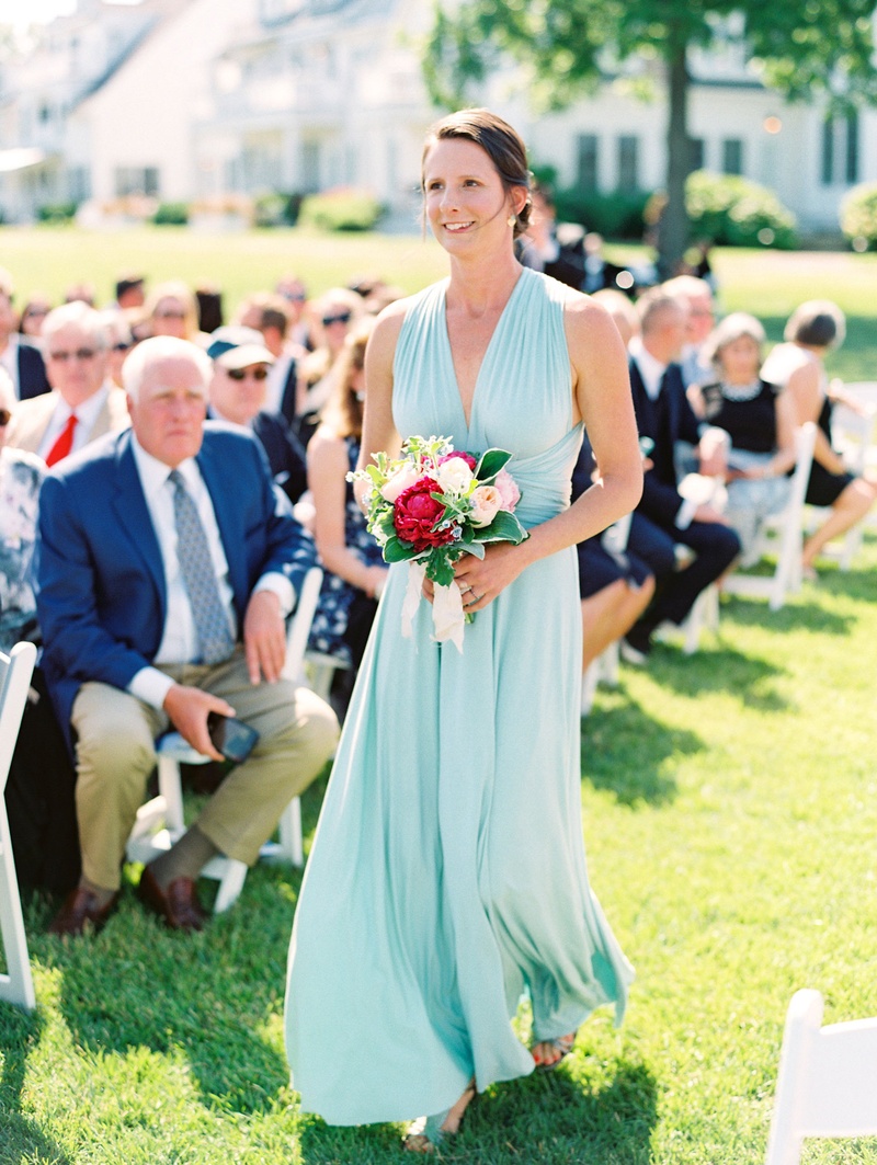 Bridesmaid in Mint Halter Dress
Photography: Bonnie Sen Photography
Read More:
http://www.insideweddings.com/weddings/outdoor-ceremony-tented-reception-by-a-tranquil-river-in-maryland/1088/ Bridesmaid walking down grass aisle in mint green blue v neck bridesmaid dress pink peony bouquet