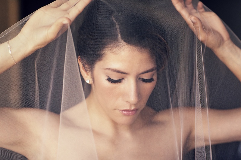 Natural Bridal Makeup
Photography: Catherine Hall Studios
Read More:
http://www.insideweddings.com/weddings/metropolitan-san-francisco-wedding-at-luxury-hotel/411/ Bride putting mantilla veil over head and face
