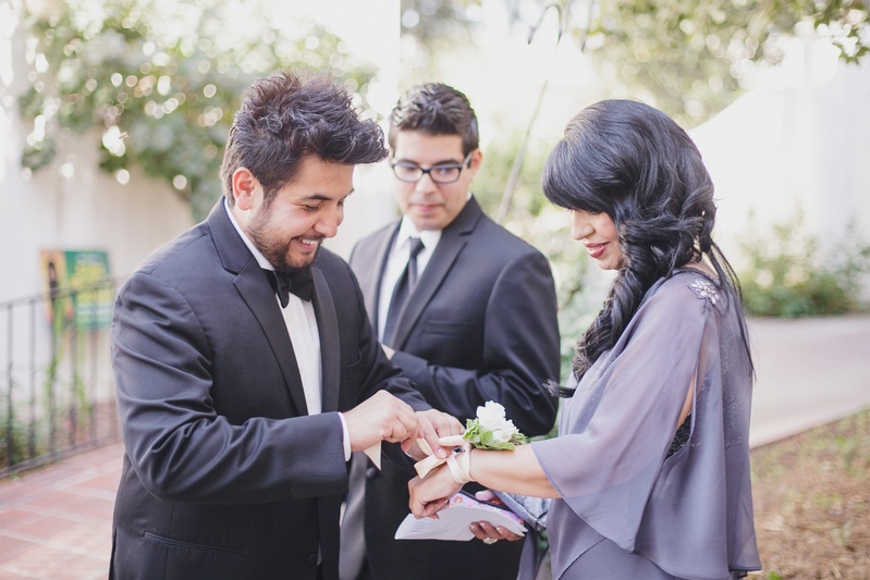 Purple Mother-of-Groom Dress
Photography: Jasmine Star Photography
Read More:
http://www.insideweddings.com/weddings/spanish-style-ceremony-outdoor-ranch-wedding-reception/504/ Groom puts corsage on mother in purple dress
