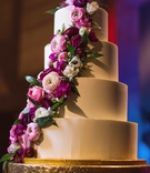 Smooth Cake with Fresh Flowers
Photography: Amanda Donaho Photography
Read More:
http://www.insideweddings.com/weddings/black-and-white-museum-wedding-with-pops-of-bright-pink/1228/ four tier wedding cake with smooth frosting and fresh pink flowers cascading down the side