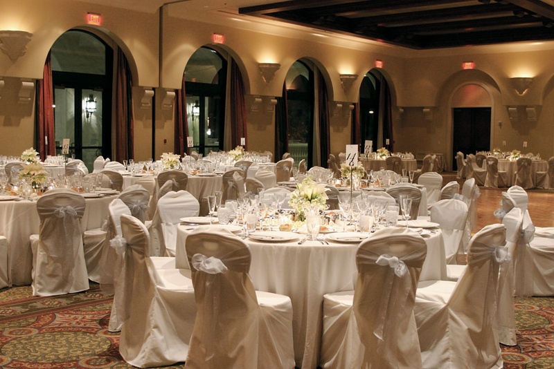 Ballroom Reception Space
Photography: Karen French Photography
Read More:
http://www.insideweddings.com/weddings/romantic-winter-wedding-in-huntington-beach-california/81/ Chairs covered in fabric and simple table designs