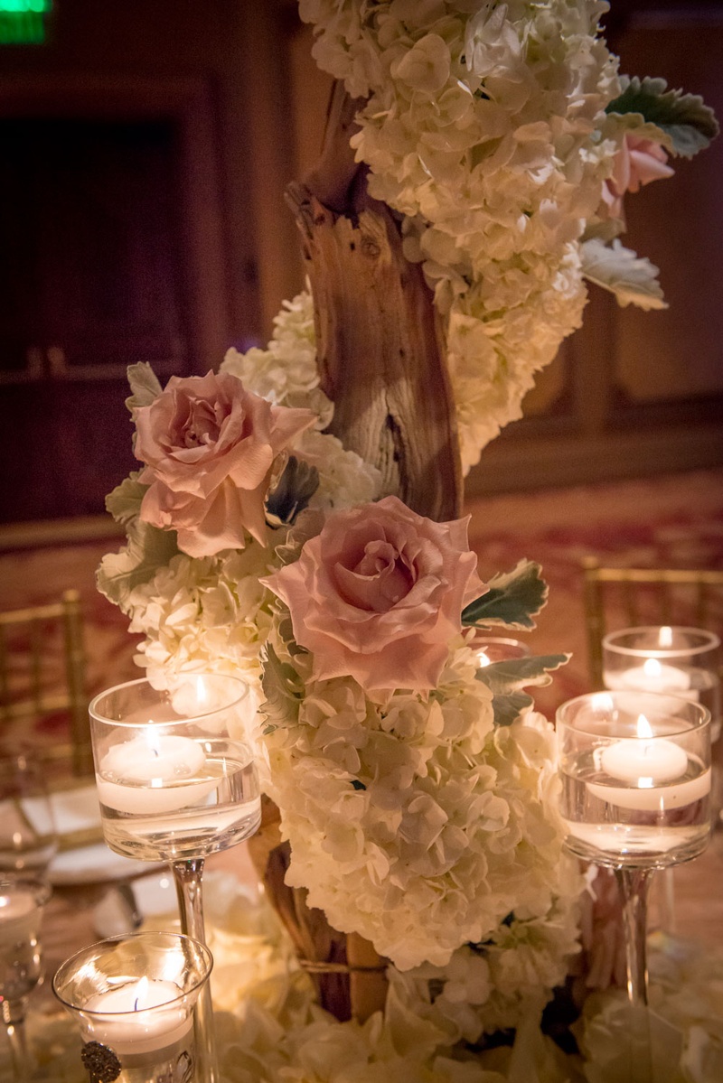 Flower-Wrapped Tree and Floating Candle Centerpieces
Photography: Boyd Harris Photographs
Read More:
http://www.insideweddings.com/weddings/a-jeweled-floral-wedding-at-fairmont-grand-del-mar-in-san-diego/745/ ivory orchid and blush rose wrapped tree, floating candle centerpieces