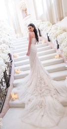 Dramatic Feathered Train on Stairs
Photography: Joe Buissink Photography
Read More:
http://www.insideweddings.com/weddings/a-music-executives-opulent-ivory-gold-wedding-in-beverly-hills/1115/ bride in inbal dror wedding dress with dramatic embellished train on stairs covered in flowers