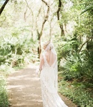 Back of Bride on Tree-Lined Path
Photography: Brooke Images
Read More:
http://www.insideweddings.com/weddings/oceanfront-ceremony-classic-ballroom-reception-in-florida/936/ bride in alon livne lace dress with v-back and fingertip veil