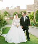 Laguna Beach Couple
Photography: Troy Grover Photographers
Read More:
http://www.insideweddings.com/weddings/jet-setter-couples-modern-wedding-with-travel-inspired-elements/528/ Bride in long-sleeve ball gown with tuxedo groom outside