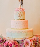 Three-Tier Light Blue %26 Pink Cake
Photography: Patrick Moyer
Read More:
http://www.insideweddings.com/weddings/vintage-inspired-alfresco-ceremony-fairy-tale-ballroom-reception/1030/ Wedding cake with key and fairy wing cake topper gold border light blue light pink vintage inspired