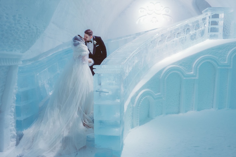 Bride %26 Groom Portrait in Ice Castle
Photography: Joel %26 Justyna
Read More:
http://www.insideweddings.com/weddings/dreamy-winter-destination-wedding-in-an-ice-castle-in-quebec-city/1270/ bride in sparkle wedding dress and cape with fur headpiece kiss groom ice staircase quebec city