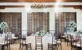 Ballroom Wedding with Dark Wood Details
Photography: Ether %26 Smith
Read More:
http://www.insideweddings.com/weddings/organic-glam-vintage-inspired-real-wedding-in-california/1180/ Bel-Air Bay Club wedding reception ballroom dark wood chairs doors high low centerpieces neutral
