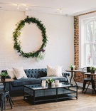 Lounge Area with Greenery Halo
Photography: Laura Gordon
Read More:
http://www.insideweddings.com/weddings/inspirational-spring-fete-with-moody-florals-modern-details/1182/ wedding reception event lounge chesterfield tufted sofa coffee table bistro table metal chair wreath