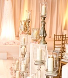 Candles Lining the Aisle
Photography: KingenSmith
Read More:
http://www.insideweddings.com/weddings/modern-wedding-with-soft-color-palette-and-personalized-details/792/ candles in metallic stands and vessels line the wedding aisle