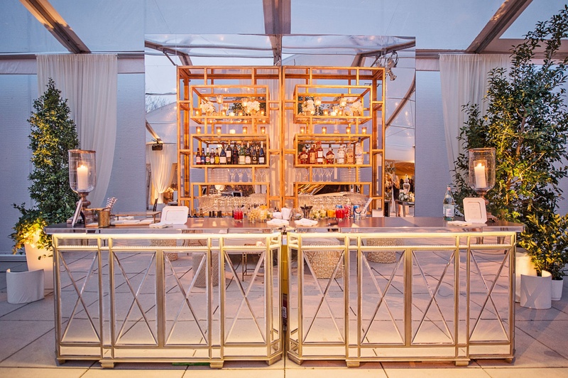 Mirror Bar with Gold Shelving
Photography: Carasco Photography
Read More:
http://www.insideweddings.com/weddings/traditional-ceremony-glamorous-garden-inspired-tented-reception/943/ Cocktail hour bar with mirror bar side and top trees tented wedding ideas