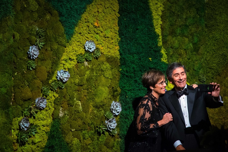 Guests Taking Selfie in Front of Moss Wall
Photography: Brett Butterstein Photography
Read More:
http://www.insideweddings.com/weddings/incredible-tented-ceremony-barn-reception-at-ranch-in-aspen/860/ Adult wedding guests in black tie attire taking selfie photo in front of moss succulent wall