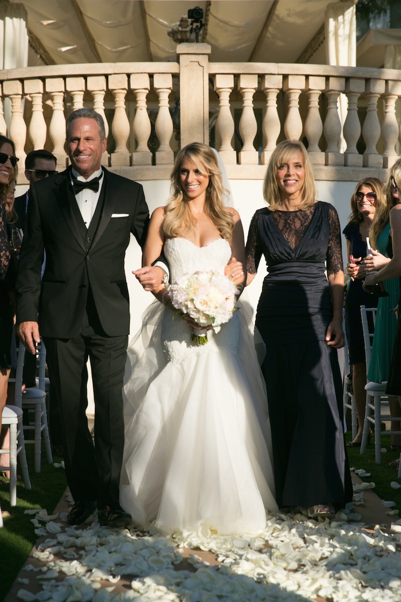 Parents Escort Bride Down Aisle
Photography: Michael Segal Photography
Read More:
http://www.insideweddings.com/weddings/poolside-ceremony-amazing-open-air-tented-reception-in-california/641/ Elegant mother-of-the-bride gown and dad in tux