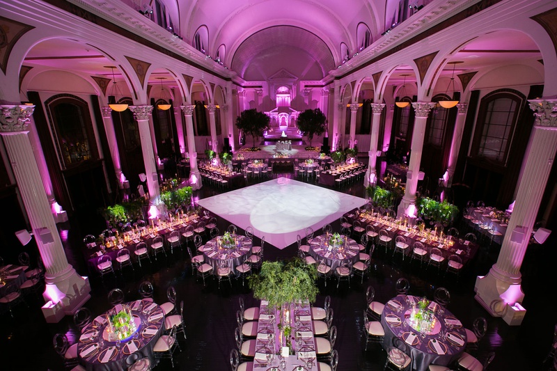 Aerial View of Large Reception Space
Photography: Callaway Gable
Read More:
http://www.insideweddings.com/weddings/modern-in-the-round-ceremony-whimsical-garden-inspired-reception/1155/ Wedding reception vibiana pink lighting violet greenery round rectangular tables dance floor columns