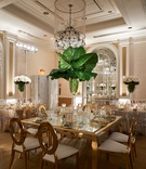 Square Gold Table with Banana Leaves
Photography: Regeti's Photography
Read More:
http://www.insideweddings.com/weddings/elegant-wedding-with-ivory-gold-green-palette-in-washington-dc/1174/ Wedding reception tall centerpiece banana leaves in vase with white roses at base gold chairs table