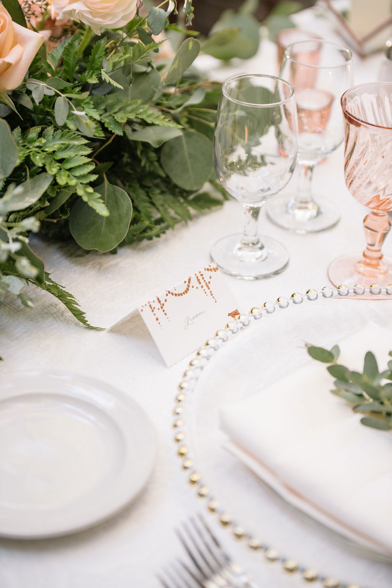 Escort Card on Classic Reception Table
Photography: Ashley Paige Photography
Read More:
http://www.insideweddings.com/weddings/elegant-outdoor-fall-wedding-at-a-rustic-chic-venue-in-malibu/1244/ wedding reception tablescape beaded charger plate minted place card greenery fern rose pink glasses