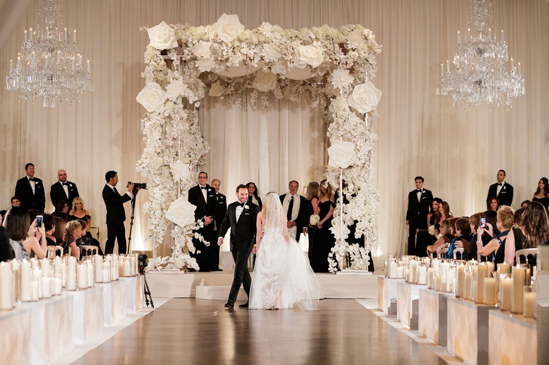 Bride %26 Groom Circling One Another
Photography: Bob %26 Dawn Davis Photography
Read More:
http://www.insideweddings.com/weddings/modern-glamorous-jewish-wedding-with-unique-decor-in-chicago/1154/ Bride and groom doing seven circles tradition jewish wedding chuppah white flowers orchid rose