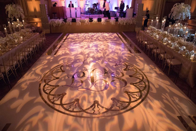 Monogram %26 Light Projections on Dance Floor
Photography: The Day by Ira Lippke
Read More:
http://www.insideweddings.com/weddings/opulent-luxury-wedding-with-timeless-color-palette-in-new-york-city/1199/ wedding reception the plaza ballroom dance floor with monogram and light projections live band