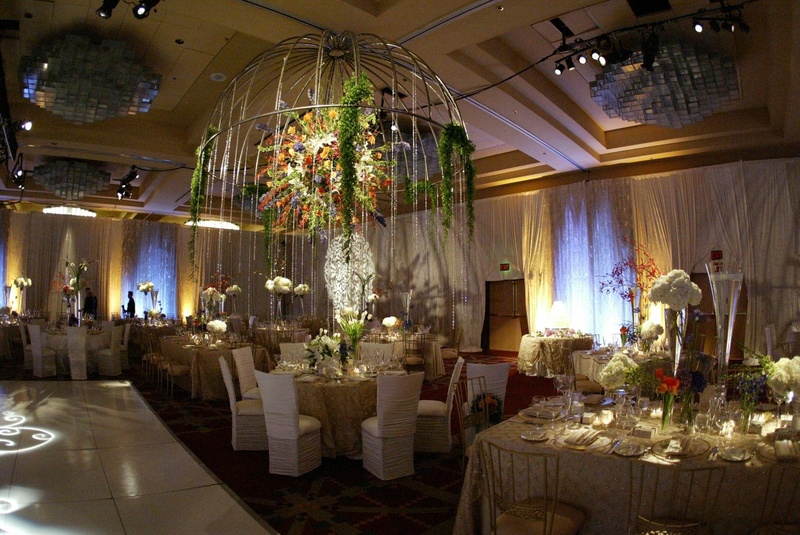 Extravagant Head Table
Photography: Lyn Sims Photographer
Read More:
http://www.insideweddings.com/weddings/glamorous-fall-wedding-with-garden-touches-in-tucson-arizona/258/ Ballroom reception space with towering centerpiece
