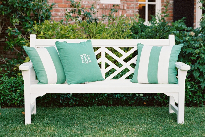 White Bench with Green Monogram Pillows
Photography: Ryan Ray Photography
Read More:
http://www.insideweddings.com/weddings/outdoor-wedding-with-vibrant-pink-orange-decor-in-california/723/ White lounge furniture with green and white stripe pillows and monogram pillow