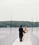 Newlyweds Take a Walk on Lake Pier
Photography: Beale %26 Wittig
Read More:
http://www.insideweddings.com/weddings/luxurious-rustic-wedding-at-lakeside-country-club-in-wisconsin/721/ Bride in a strapless Vera Wang dress, updo, veil walks with groom in black tuxedo on Lake Geneva
