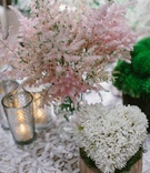 White Heart-Shaped Flower Arrangement
Photography: Amy %26 Stuart Photography
Read More:
http://www.insideweddings.com/weddings/rustic-elegant-outdoor-ceremony-luxe-garden-inspired-reception/869/ Wood stump with white flower heart shape centerpiece pink soft flowers on lace table linen