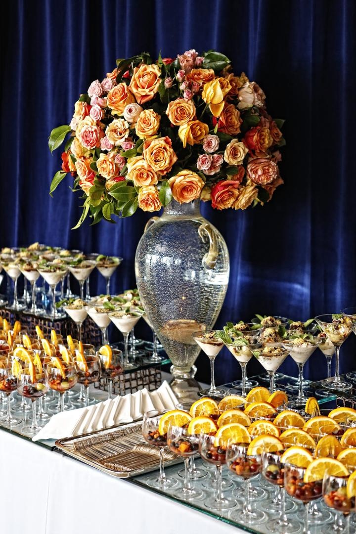 Dessert Table
Photography: Tomas Ramos Photographers
Read More:
http://www.insideweddings.com/weddings/houston-indian-wedding-celebration-with-800-person-guest-list/435/ Wedding dessert table with desserts in stemware and floral arrangement of orange and pink roses