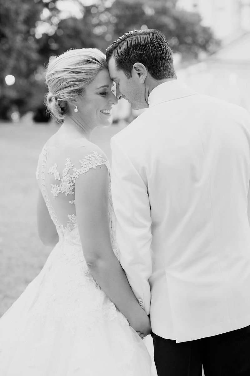Photo of Couple Touching Noses
Photography: Sarah Kate, Photographer
Read More:
http://www.insideweddings.com/weddings/outdoor-fall-ceremony-opulent-tented-reception-in-dallas-texas/1022/ Black and white eskimo kiss bridal wedding portrait groom bride romona keveza wedding dress