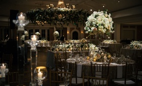 Sophisticated Houston Wedding Reception
Photography: Chris Bailey Photography
Read More:
http://www.insideweddings.com/weddings/sophisticated-southern-soiree-in-texas-with-an-ode-to-new-orleans/1093/ Wedding reception with round and rectangular tables white flowers greenery candles winter decor idea