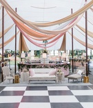 Sailcloth Tent with Drapery %26 Dance Floor
Photography: Liz Banfield
Read More:
http://www.insideweddings.com/weddings/destination-fete-with-chapel-ceremony-charming-tented-reception/1179/ Wedding reception tent checkerboard dance floor lounge furniture wood chairs linen tables bar