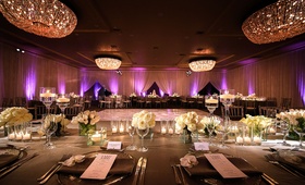 Purple Reception Lighting in Ballroom
Photography: Next Exit Photography
Read More:
http://www.insideweddings.com/weddings/alfresco-interfaith-ceremony-ballroom-reception-in-santa-monica/963/ Wedding reception Fairmont Miramar Hotel & Bungalows ballroom purple lighting and white flowers grey