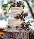 Carrot Cake with Wildflowers
Photography: Sallee Photography
Read More:
http://www.insideweddings.com/weddings/rustic-chic-lakeside-wedding-with-geometric-details-in-california/843/ carrot cake with cream cheese frosting on a tree trunk slab, decorated with wildflowers, pinecones