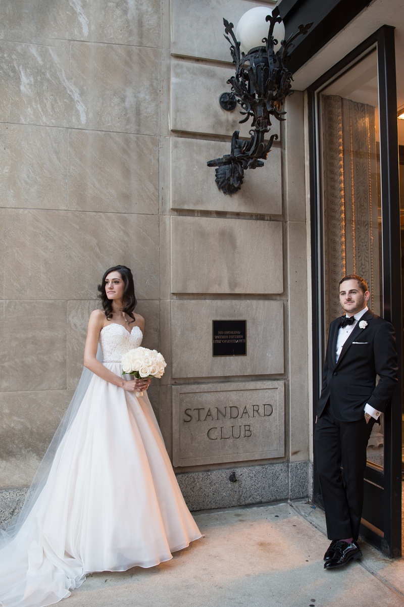Couple Poses Cooly in Front of Venue
Photography: Carasco Photography
Read More:
http://www.insideweddings.com/weddings/jewish-wedding-with-classic-ivory-and-gold-decor-in-chicago/983/ bride in essence of australia wedding dress, groom in bonobos tux, cool pose standard chicago