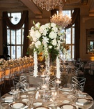 Centerpiece with Cascading Orchids
Photography: L Photographie
Read More:
http://www.insideweddings.com/weddings/church-ceremony-elegant-reception-with-silver-details/1127/ silver linens, centerpiece with large white flowers and cascading garland of orchids