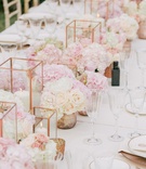Copper Candle Holders %26 Pink Flowers
Photography: Maitha Lunde
Read More:
http://www.insideweddings.com/weddings/beautiful-alfresco-destination-wedding-in-the-south-of-france/1039/ Wedding reception long centerpiece mini rose arrangements candle votives rose gold vessels geometric