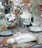 Mirrored Ball Centerpiece
Photography: Maring Lifestyle Photography
Read More:
http://www.insideweddings.com/weddings/winter-circus-wedding-at-the-ringling-museum-of-art-in-florida/150/ Reception table with mirror disco ball and glass boxes
