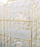 Glasses Displayed in Front of Flower Wall
Photography: Brandon Chesbro
Read More:
http://www.insideweddings.com/weddings/classic-white-wedding-at-a-historic-estate-in-nashville/1219/ flower wall of ivory roses, gold stand displaying wine glasses at wedding reception
