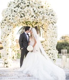 Bride %26 Groom in Front of Lush Arch
Photography: Samuel Lippke Studios
Read More:
http://www.insideweddings.com/weddings/alfresco-ceremony-with-ocean-view-glamorous-tented-reception/1081/ Bride in galia lahav mermaid wedding dress kissing groom in front of canopy of white flowers