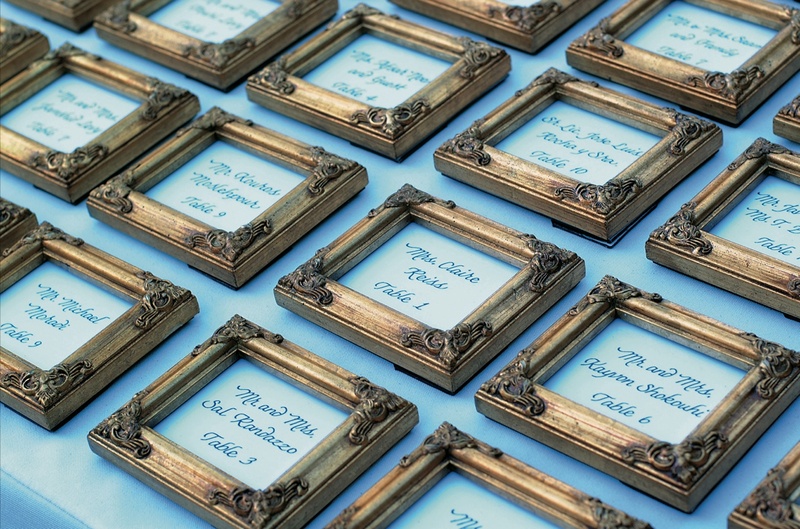 Framed Escort Cards
Photography: Lifetime Images (Steven Schlesinger)
Read More:
http://www.insideweddings.com/weddings/formal-black-tie-wedding-in-la-jolla-california/52/ White escort card in golden frame