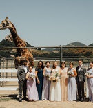Bride's Getting-Ready Crew with Giraffe
Photography: Heirlume Photography
Read More:
http://www.insideweddings.com/weddings/elegant-personalized-wedding-with-adventure-motif-in-malibu/1308/ bride with mismatched bridesmaids and bridesmen in front of stanley the giraffe at saddlerock ranch
