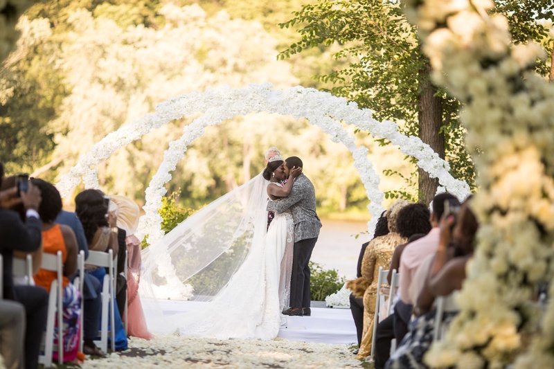 Bride %26 Groom Kiss Under Floral Arches
Photography: Brian Bossany Photography
Read More:
http://www.insideweddings.com/weddings/luxurious-heaven-inspired-royal-wedding-celebration-in-minneapolis/1333/ bride and groom kiss under white flower arches outdoor garden ceremony ghana royalty africa wedding