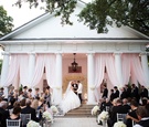 Bride & Groom on Porch of Venue