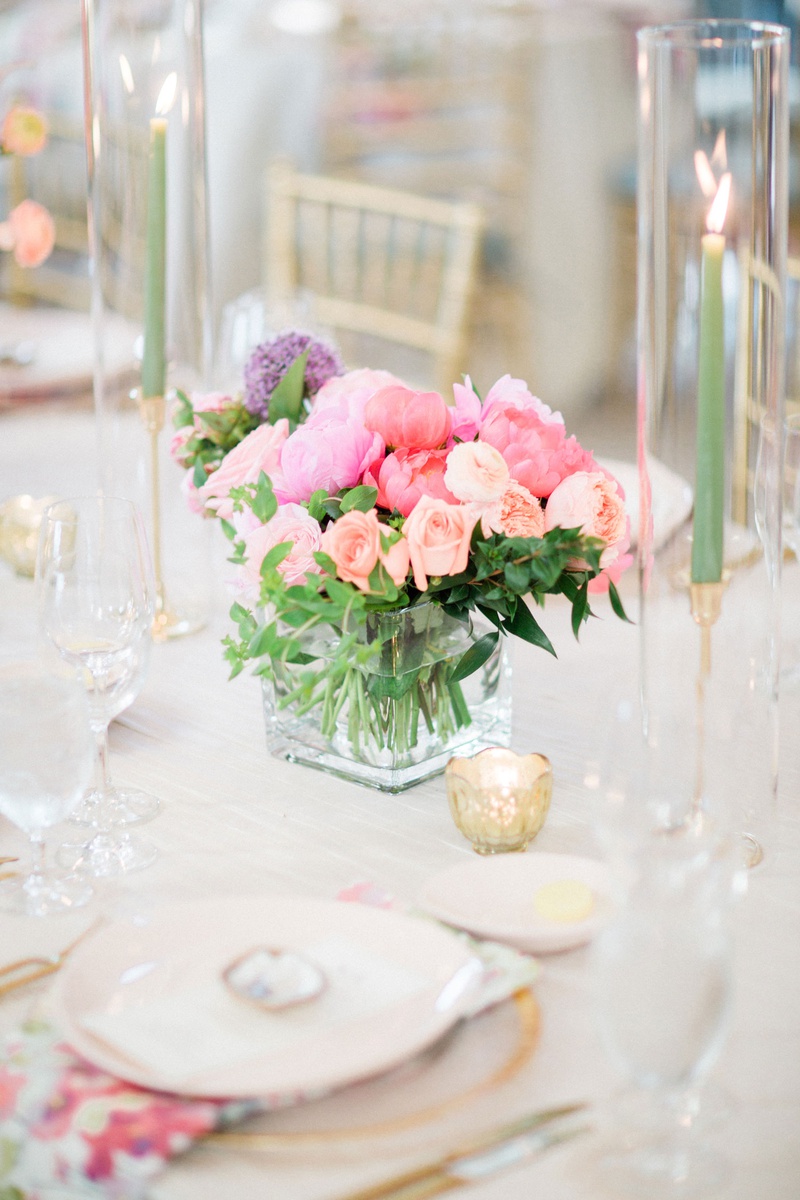 Floral Pattern Napkin with Low Centerpiece
Photography: Vitor Lindo Photo + Video
Read More:
http://www.insideweddings.com/weddings/soft-romantic-spring-destination-wedding-in-south-carolina/1285/ wedding reception table setting flower print napkin light pink purple coral flower centerpiece taper
