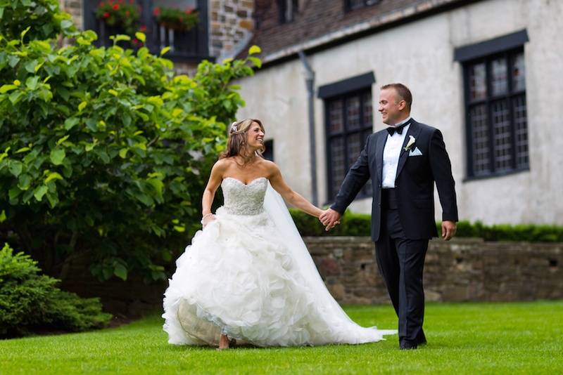 Bride %26 Groom at Pleasantdale Château
Photography: Images by Berit, Inc.
Read More:
http://www.insideweddings.com/weddings/wedding-with-purple-modern-details-at-a-chateau-in-new-jersey/693/ Bride in a strapless Lazaro dress with beaded bodice, ruffled skirt walks with groom in black tuxedo