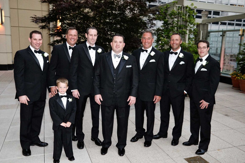 Groom, Groomsmen %26 Ring Bearer in Chicago
Photography: KingenSmith
Read More:
http://www.insideweddings.com/weddings/delicately-detailed-chicago-wedding-with-jewish-christian-customs/762/ groom and ring bearer and groomsmen in black tuxedos stand in chicago