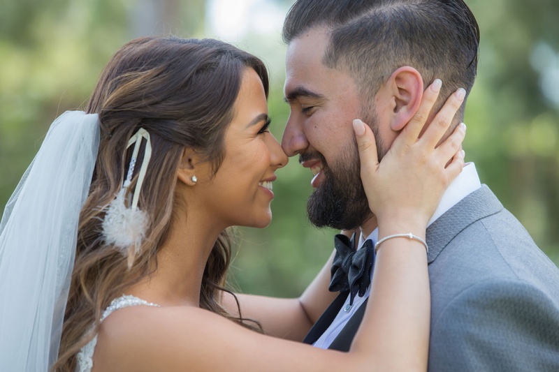Bride %26 Groom Cute Portrait Ideas
Photography: Curtis Dahl Photography
Read More:
http://www.insideweddings.com/weddings/spring-outdoor-ceremony-ballroom-reception-with-cultural-elements/1313/ bride holding groom face and touching nose eskimo kisses bride with veil and feather hair accessory