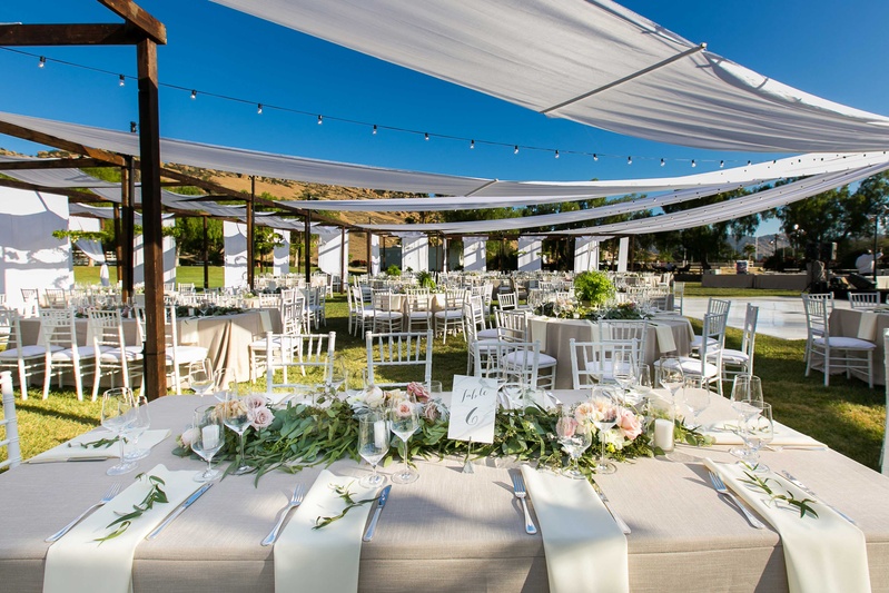 Alfresco Reception, Champagne Tablescapes
Photography: Callaway Gable
Read More:
http://www.insideweddings.com/weddings/alfresco-summer-wedding-with-lush-foliage-accents-in-california/805/ semi tented outdoor reception space with champagne colored tablescapes hanging lights low florals
